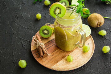 Healthy smoothie of fresh green fruits. Creative atmospheric decoration
