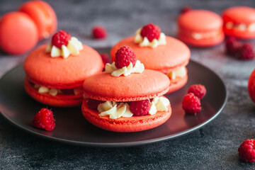 Macaroons. Delicious french desserts. Macaroons with raspberries and cream cheese. Macaroons on the table