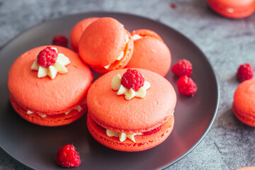 Macaroons. Delicious french desserts. Macaroons with raspberries and cream cheese. Macaroons on the table