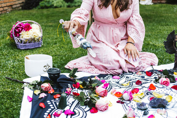 Hispanic holistic therapist using a crystal wand and other healing objects in Latin America