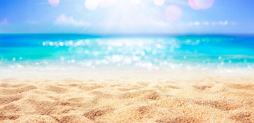 Fototapeta na wymiar Beach - Sand With Abstract And Defocused Ocean In Background