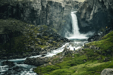 Powerful Folaldafoss waterfall flows in basalt volcanic rocks. East Iceland, Europe.