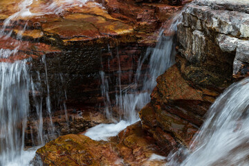Water flowing over brown rocks