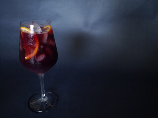 glass of sangria on black back ground