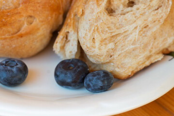 Bread texture close up. Fresh bread bun background close-up shoot.
Whole grain bread on a plate close-up. Fresh bread Healthy food and traditional bakery concept