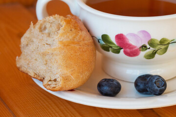 Bread texture close up. Fresh bread bun with tea close-up.
Whole grain bread on a plate close-up. Fresh bread Healthy food and traditional bakery concept