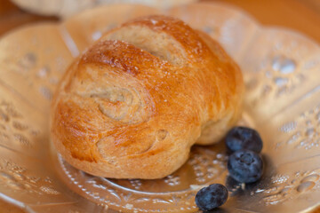 Bread texture close up. Fresh bread bun background close-up shoot.
Whole grain bread on a plate close-up. Fresh bread Healthy food and traditional bakery concept