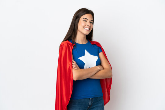 Young Brazilian woman isolated on white background in superhero costume with arms crossed
