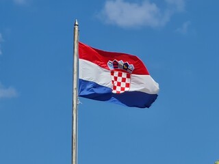 Fototapeta premium Croatian flag on blue sky. Country flag against sky. Flags of the world