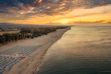 Aerial view of beautiful sea and beach sunrise, seascape and hill mountain on backgrond, Simeri Mare, Calabria, Southern Italy