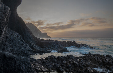 Landscape of rock formation in Barronal beach in Cabo de Gata nature park, Spain, during sunrise
