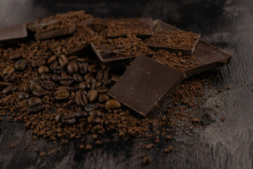 a scattering of dark chocolate with coffee beans