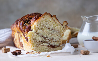 Cinnamon and brown sugar babka or brioche bread with milk. Homemade pastry for breakfast.