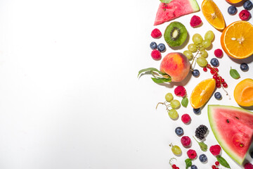 Summer vitamin food concept, various fruit and berries watermelon peach plum apricots blueberry currant, flat lay on white background top view copy