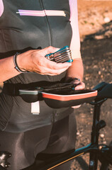 Close-up of a woman's hands with tools to fix a bicycle. Cycling concept. Sport concept.