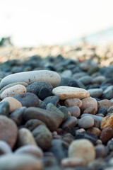 Fototapeta na wymiar Texture of multi-colored stones on the black sea coast