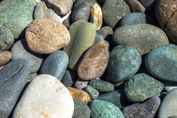Texture of multi-colored stones on the black sea coast