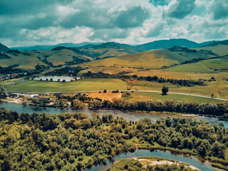 Beautiful aerial panoramic view of the Pieniny National Park, Poland in sunny day. Sokolica and Trzy Korony - English: Three Crowns (the summit of the Three Crowns Massif) and Dunajec river © udmurd