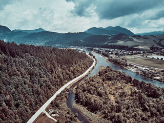 Beautiful aerial panoramic view of the Pieniny National Park, Poland in sunny day. Sokolica and Trzy Korony - English: Three Crowns (the summit of the Three Crowns Massif) and Dunajec river © udmurd