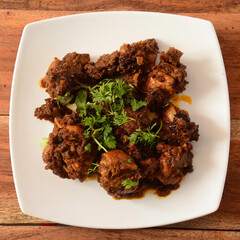 Tawa mutton fry or tawa gosht is authentic spicy lamb dish.Cooked with spices,served over a rustic...