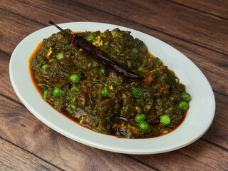 Veg Patiala, a creamy gravy with mixed veggies layered with fried papad, a unique taste and a delicious accompaniment with your parathas