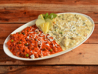 Two different types of Mattar curry made of Indian spices. served over a rustic wooden table. selective focus