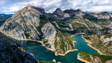 Naklejka na ściany i meble Lake surrounded by mountains and crazy colors 