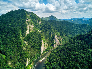 Beautiful aerial panoramic view of the Pieniny National Park, Poland in sunny day. Sokolica and Trzy Korony - English: Three Crowns (the summit of the Three Crowns Massif) and Dunajec river © udmurd