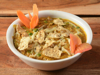 Mix veg jaipuri is a delicious mixed vegetable curry made with mixed vegetable, paneer cubes in a tomato-onion based gravy, served over a rustic wooden table, selective focus