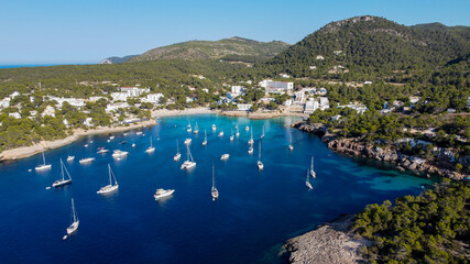 Aerial view of the bay of Portinatx on the north shore of Ibiza island in Spain - Yachts anchored...