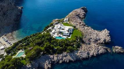 Acrylic prints North Europe Luxurious mansion on a private islet north of Ibiza island in Spain - Large property with a white villa along the Mediterranean Sea in the Balearic Islands