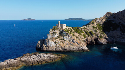 Aerial view of the abandonned lighthouse on the Punta Grossa cape, in the east of Ibiza island in...