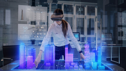 Female Architect wearing Augmented Reality Lenses makes gestures and redesigns 3D City Model. High...