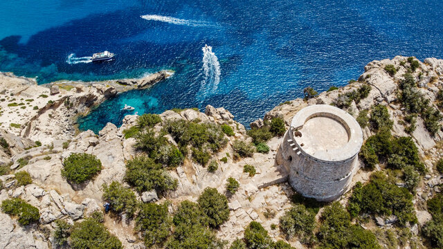 Aerial view of the Torre des Savinar, at the western tip of Ibiza island in the Balearic Islands, Spain - Medieval fortified tower overlooking the Mediterranean Sea