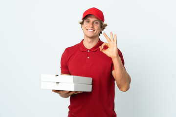 pizza delivery man over isolated white background showing ok sign with fingers