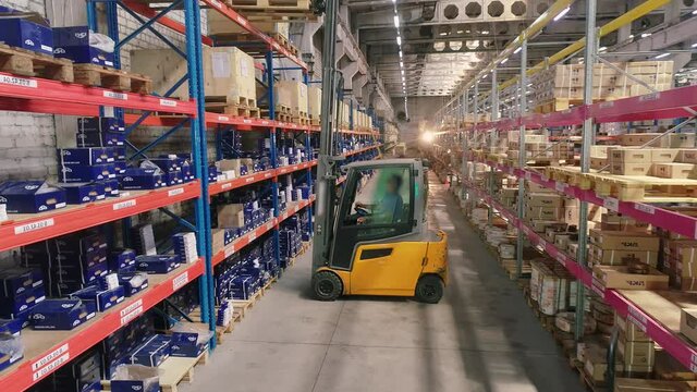 Forklift in the warehouse. Work forklift in a modern warehouse. Industrial interior