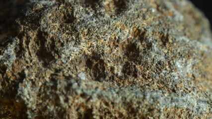 VOLCANIC ROCK WITH MINERALS, MACRO IMAGE WITH BLACK BACKGROUND