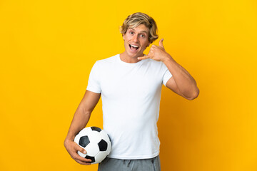 English football player over isolated yellow background making phone gesture. Call me back sign