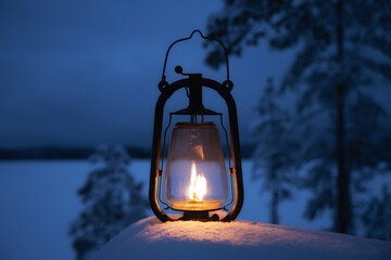 Old lantern in the night. Camping in the forest at winter season. Ancient lamps. Lighting by the...