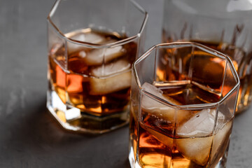 whiskey glass on a concrete background with copy space. alcohol addiction concept