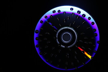 multi-colored and colorful CD on a black background