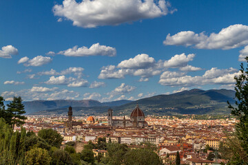 Fototapeta na wymiar The cityscape of beautiful Florence, Italy, with fluffy clouds in the blue sky