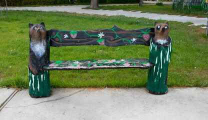 Carved wooden benches depicting animals and fairy-tale characters in the city park