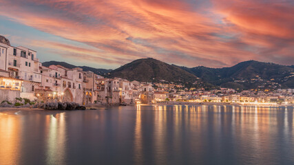 Obraz premium Old building on beach in Cefalu at night. Sicily stock photo. Cityscape, Sicily, Cefalu, Europe, Beach