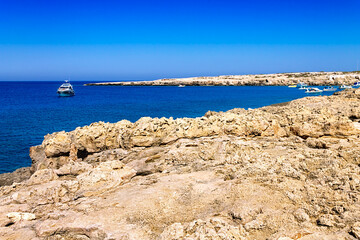 Tourist yachts and boats in the blue lagoon. A popular place in the Cape Greco National Forest Park...