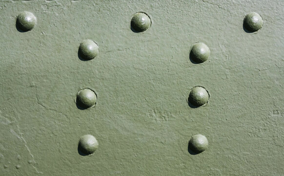 Rivets and Metal Background Dark Green Painted. Metal Military Grade Backdrop