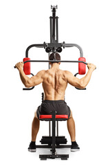 Obraz premium Shirtless musuclar man exercising back muscles with a bar on a fitness machine