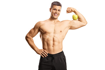 Fototapeta premium Young shirtless musuclar man flexing arm muscle and holding an apple