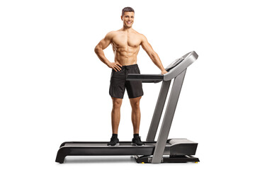 Fototapeta premium Full length shot of a bodybuilder posing on a treadmill
