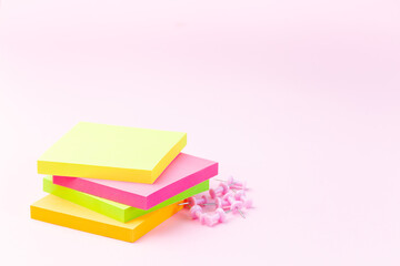 Empty colorful notes, pins near, stationery on pink background, horizontal, copy space